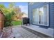 The backyard patio features a grill and mature landscaping at 1464 Spotted Owl Way, Highlands Ranch, CO 80129