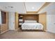 Cozy bedroom featuring built-in shelving and neutral carpeting for a comfortable retreat at 1464 Spotted Owl Way, Highlands Ranch, CO 80129