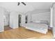 Bright and airy bedroom with a king-sized bed, ensuite bathroom, and large closet at 1464 Spotted Owl Way, Highlands Ranch, CO 80129