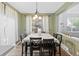 Charming dining area with natural light, hardwood floors, and comfortable seating for Gathering gatherings at 1464 Spotted Owl Way, Highlands Ranch, CO 80129