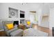 Open living area featuring a cozy fireplace, and neutral color palette, creating an inviting atmosphere at 1464 Spotted Owl Way, Highlands Ranch, CO 80129