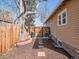 Cozy backyard featuring a wooden fence, large tree, and space for outdoor enjoyment at 6940 W 48Th Ave, Wheat Ridge, CO 80033