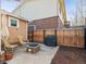 Backyard patio with room to relax, including patio furniture, fence, and a Weber grill at 6940 W 48Th Ave, Wheat Ridge, CO 80033