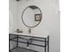 Modern bathroom with stylish sink, metal frame, and unique lighting at 6940 W 48Th Ave, Wheat Ridge, CO 80033