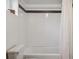 Bathroom featuring a white tiled shower and black trim, adding a modern touch at 6940 W 48Th Ave, Wheat Ridge, CO 80033