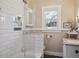 Elegant bathroom with subway tile shower, stylish vanity, and modern fixtures at 6940 W 48Th Ave, Wheat Ridge, CO 80033
