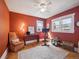 Stylish bedroom featuring warm colors, natural light, ceiling fan and hardwood flooring at 6940 W 48Th Ave, Wheat Ridge, CO 80033