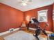 Cozy bedroom features natural light, warm colors and hardwood flooring at 6940 W 48Th Ave, Wheat Ridge, CO 80033