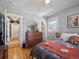Comfortable bedroom with hardwood floors, closet, and lots of natural light at 6940 W 48Th Ave, Wheat Ridge, CO 80033