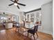 Bright dining area with bench seat and a view, adjacent to the cozy living room at 6940 W 48Th Ave, Wheat Ridge, CO 80033