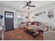 Bright, cozy living room featuring stylish furniture, a ceiling fan, and a welcoming atmosphere at 6940 W 48Th Ave, Wheat Ridge, CO 80033