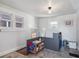 Functional mud room featuring tile floors, natural light and built-in storage at 6940 W 48Th Ave, Wheat Ridge, CO 80033