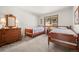 Bedroom with two twin beds, natural light, and classic decor at 29089 Western Ln, Evergreen, CO 80439