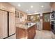 Well-lit kitchen with granite countertops, stainless steel appliances, and wooden island at 29089 Western Ln, Evergreen, CO 80439