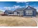 Exterior of the home with a large yard, featuring a deck and a blue exterior at 5372 Lenox Ct, Castle Rock, CO 80104