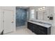 Modern bathroom featuring a glass-enclosed shower with accent tiles and sleek vanity with a marble countertop at 5372 Lenox Ct, Castle Rock, CO 80104