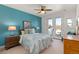 Bedroom featuring a queen bed, ceiling fan, and access to a private balcony with natural light at 5372 Lenox Ct, Castle Rock, CO 80104