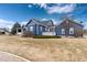 Beautiful two-story home with blue siding, white trim, and a well-manicured lawn at 5372 Lenox Ct, Castle Rock, CO 80104