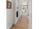 Hallway featuring hardwood floors and access to various rooms in the home at 5372 Lenox Ct, Castle Rock, CO 80104