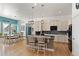 Open concept kitchen features an island with seating, granite countertops, and modern appliances at 5372 Lenox Ct, Castle Rock, CO 80104
