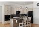 Modern kitchen features dark countertops, stainless steel appliances, and a kitchen island with barstool seating at 5372 Lenox Ct, Castle Rock, CO 80104