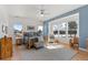 Comfortable main bedroom with a ceiling fan, hardwood floors, ample natural light, and wood furniture at 5372 Lenox Ct, Castle Rock, CO 80104
