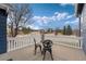 Outdoor patio with table and chairs, offering a cozy space for relaxation or entertaining at 5372 Lenox Ct, Castle Rock, CO 80104