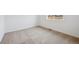 Clean bedroom with neutral carpet, offering ample natural light and a view of the neighborhood at 24717 E 40Th Ave, Aurora, CO 80019