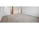 Cozy bedroom featuring soft carpeting and a doorway leading to the rest of the house at 24717 E 40Th Ave, Aurora, CO 80019