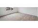 Neutral bedroom featuring soft carpeting and bright natural light from a large window at 24717 E 40Th Ave, Aurora, CO 80019