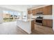 Modern kitchen featuring an island with a white countertop and stainless steel appliances at 24717 E 40Th Ave, Aurora, CO 80019