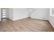 Spacious living room featuring light wood floors, neutral walls, and ample natural light at 24717 E 40Th Ave, Aurora, CO 80019