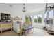 Inviting bedroom features a bay window with bench seating and whimsical, colorful furnishings at 9479 S Shadow Hill Cir, Lone Tree, CO 80124