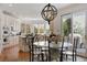 Bright eat-in kitchen with views to the backyard has modern appliances, an island, and a dining table at 9479 S Shadow Hill Cir, Lone Tree, CO 80124