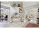 Bright foyer showcases a grand staircase with decorative ironwork and elegant tile flooring at 9479 S Shadow Hill Cir, Lone Tree, CO 80124