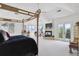 Spacious primary bedroom boasts a fireplace, balcony access, and a large window offering scenic views at 9479 S Shadow Hill Cir, Lone Tree, CO 80124