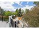A backyard pool with a cover, and outdoor seating are surrounded by trees and landscaping at 9479 S Shadow Hill Cir, Lone Tree, CO 80124