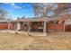 Brick home with covered patio and spacious backyard at 340 S Swadley St, Lakewood, CO 80228
