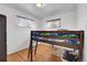Bright bedroom with wood floors and a built-in bunk bed at 340 S Swadley St, Lakewood, CO 80228