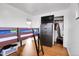 Cozy bedroom featuring wood floors, a closet, and a dresser at 340 S Swadley St, Lakewood, CO 80228