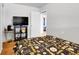 Serene bedroom with wood floors, a flat-screen TV, and a double bed at 340 S Swadley St, Lakewood, CO 80228