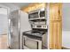 Stainless steel appliances and wood cabinets in this kitchen at 340 S Swadley St, Lakewood, CO 80228