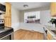 Eat-in kitchen with wood cabinets, granite countertops, and a window at 340 S Swadley St, Lakewood, CO 80228