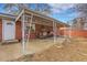Brick home with covered patio and seating area at 340 S Swadley St, Lakewood, CO 80228