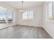 Bright dining room with hardwood floors and access to the patio at 17811 E 93Rd Ave, Commerce City, CO 80022