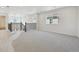 Spacious loft area with carpeted floor and large window at 17811 E 93Rd Ave, Commerce City, CO 80022