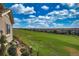 Backyard view of a golf course community and blue sky at 6638 S Tibet Ct, Aurora, CO 80016