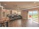 Spacious finished basement with kitchenette, comfortable seating and glass doors to the outside at 6638 S Tibet Ct, Aurora, CO 80016