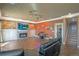 Finished basement area with fireplace, TV, bar and stairs to the upper level at 6638 S Tibet Ct, Aurora, CO 80016