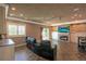 A cozy finished basement area includes a fireplace, television, and backyard access at 6638 S Tibet Ct, Aurora, CO 80016